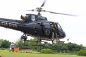 Helicóptero da polícia civil levantando voo